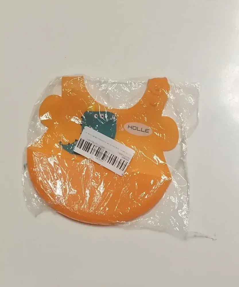 Silikonový bryndáček - DINOSAURUS - ORANŽOVÝ